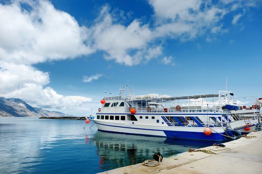 Small ferryboat docked in greek town