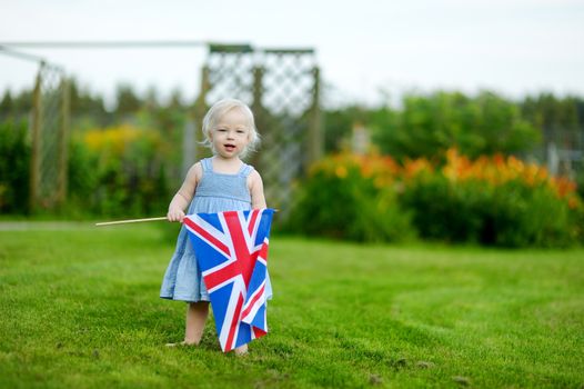 Adorable little girl with United Kingdom flag