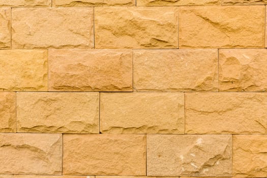 Close-up shot of stone brick wall revealing texture and detail.
