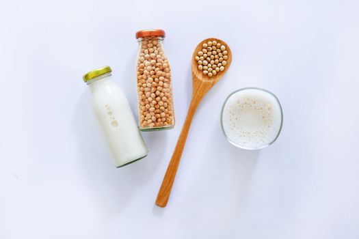 Soy milk and soybean on white background.