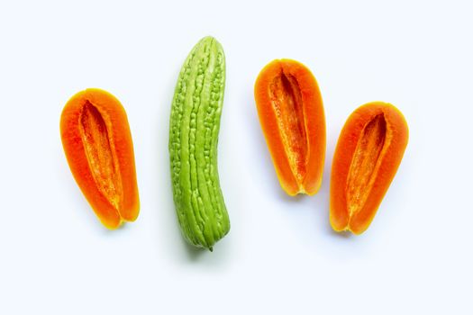 Bitter melon with papaya on white background. Sex concept, Copy space
