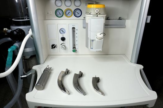 an anesthetic with a set of laryngoscope and blades