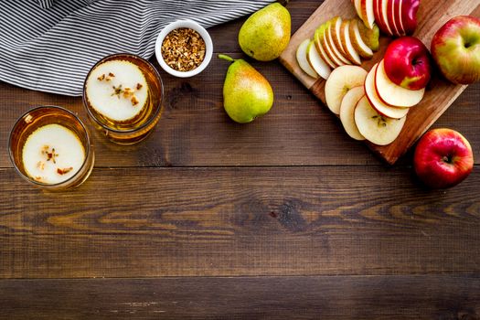 Fruit drinks with apple and pear on wooden table top-down copy space