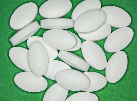white pills in a pile