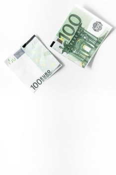 Cutting of euro banknote. Economic crisis concept