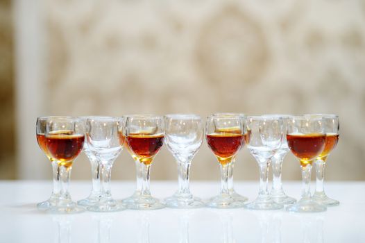 Glasses of brandy arranged in a row