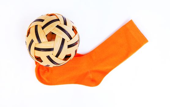 Sepak Takraw ball and orange socks For sports, exercise.