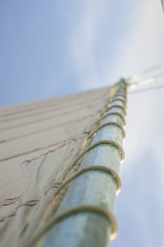 Abstract view of old sailing boat mast with rigging