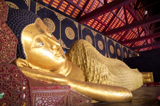 Reclining Buddha (Sleep Buddha) at Wat Chedi Luang in Chiang Mai, Thailand. Wat Chedi Luang is one of the most popular famous tourist attraction temples in Chiang Mai.