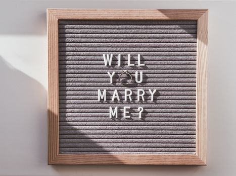 Top view on letter board with wedding proposal - Will You Marry 