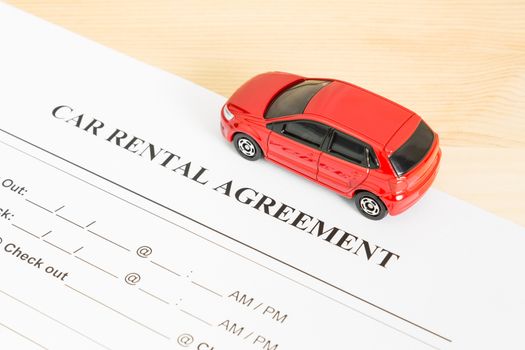 Car Rental Agreement With Red Car on Right View