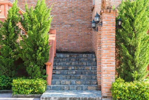 vintage stone stair and red brick wall