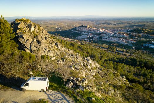 Castelo de Vide drone aerial view in Alentejo, Portugal from Serra de Sao Mamede mountains and a camper van
