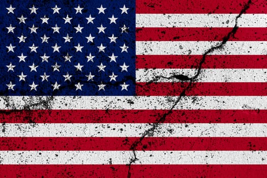 USA flag on cracked concrete wall. The concept of crisis, default, economic collapse, pandemic, conflict, terrorism or other problems in the country. Abstract disaster symbol.