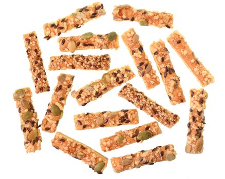 Mini seeded straws topped with cheese and seeds top view