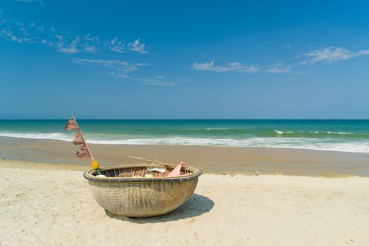 Traditional fishing boat on the beach of Hoi An