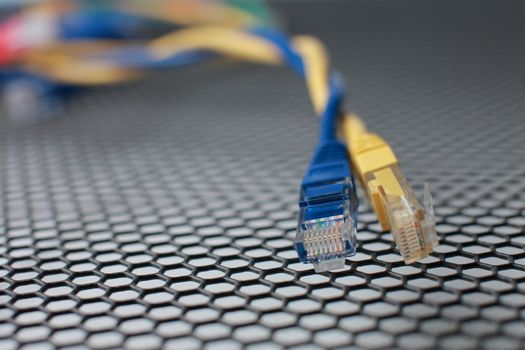 Network Ethernet Cables. Network switch with optical and ethernet connected wires.