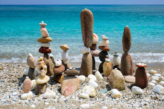 Concept of balance and harmony - pebble stone stacks on the beach