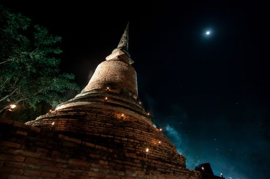 Temple at the Sukhothai Historical Park in the full moon night d