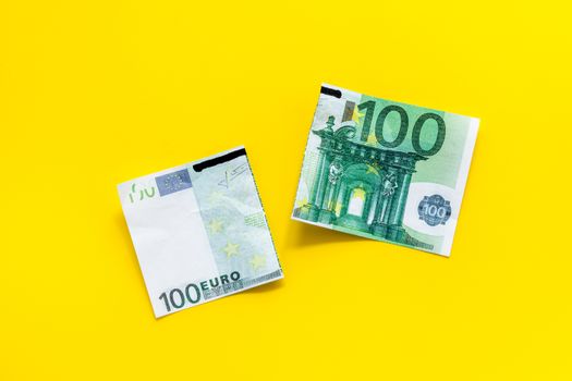 Cutting of euro banknote. Economic crisis concept