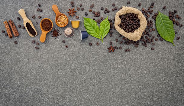 Coffee beans ,coffee capsule and coffee powder on dark stone bac