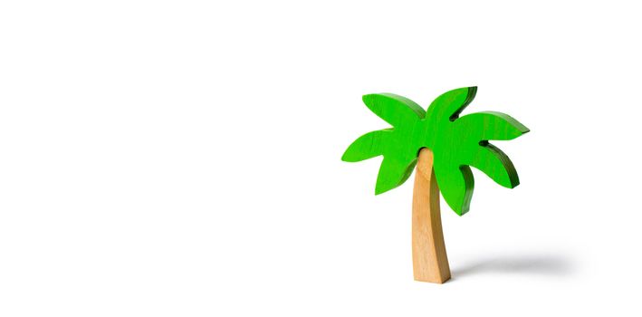 Wooden palm tree on an isolated background. Conceptual leisure and vacation, entertainment and relaxation. Tours and cruises to warm countries. The development of tourism. Tropical island.