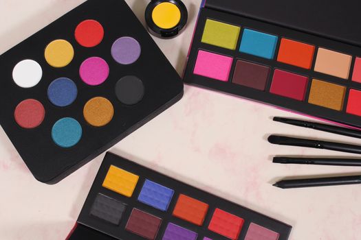 Various Colorful Cosmetics on paper