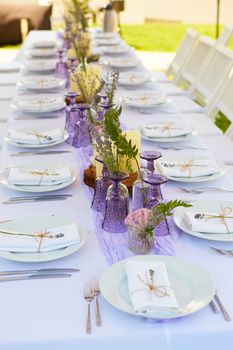 Table set for wedding or another catered event dinner. Shallow dof