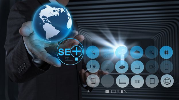 businessman hand showing search engine optimization SEO