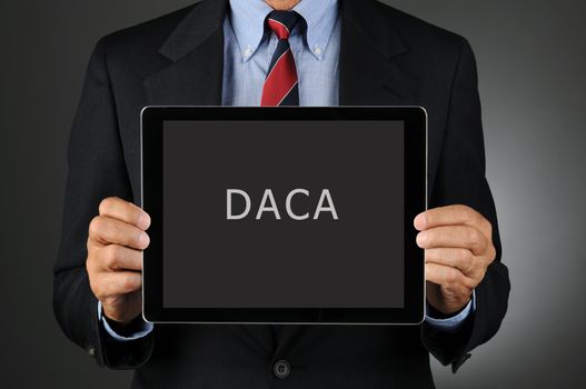 Lawmaker Holding Tablet Computer with DACA Message