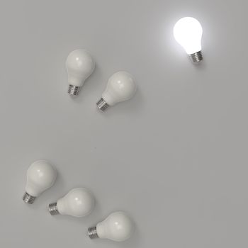 3d growing light bulb standing out from the unlit incandescent b