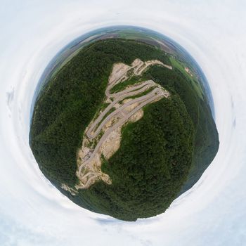 360 spherical panorama of aerial top vew of winding road in the mountains