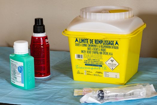 Yellow Medical waste container (with indication in French) use at home for cancer treatment