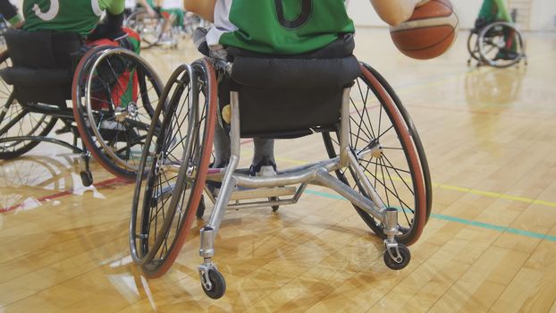 Disabled sportsmen plays wheelchair basketball