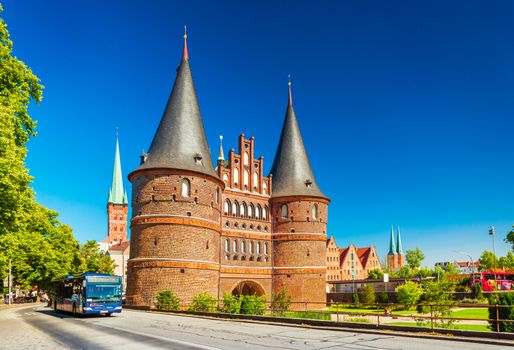 Lubeck - July 2018, Germany: Medieval City Gate (Holstentor) in the old German Hanseatic city. Brick Gothic architectural style, popular landmark