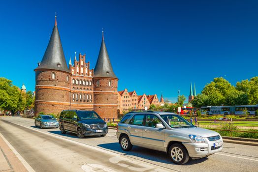 Lubeck - July 2018, Schleswig-Holstein, Germany: View of The Holsten Gate (Holstentor) in the old Hanseatic town. Brick Gothic architectural style
