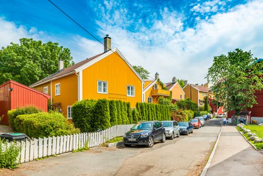Oslo - June 2019, Norway: A typical street of Oslo with colorful wooden houses in the traditional architectural style