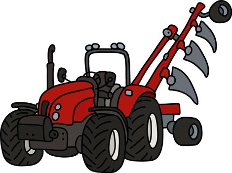The red tractor with a plow