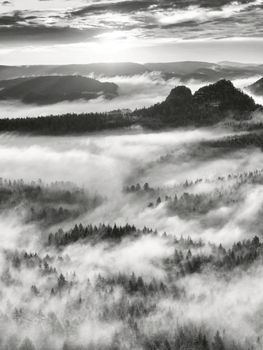 Black and white mist, daybreak in beautiful hills. Peaks of hills 