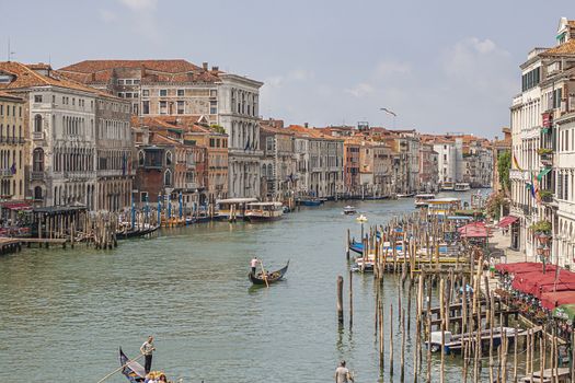 Canal grande landscape with boats and gondolas in Venice