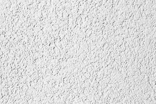 Texture of a white stone decorative plaster or concrete wall. Abstract background for design with copy space for a text.