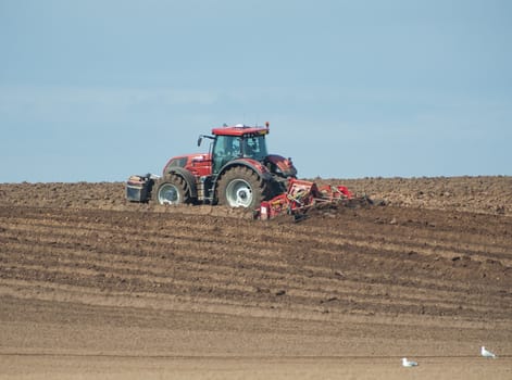 Tractor ploughing agricultural land