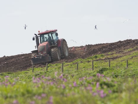 Tractor ploughing agricultural land