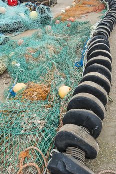 Fishing nets lying on quayside