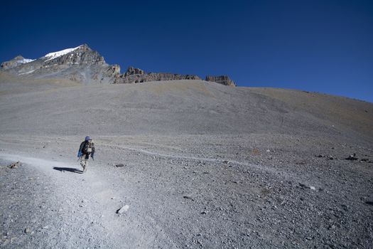 Solo trekker on mountain, enjoying in nature, landscape photogra