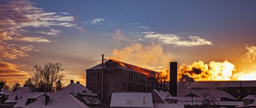 sunrise over frozen buildings
