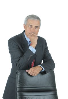Businessman leaning on chair back
