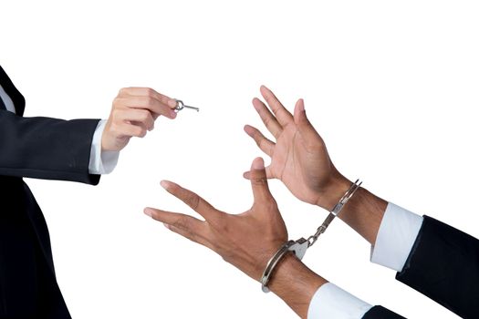 businessman in handcuffs and woman hand offering key solving bus