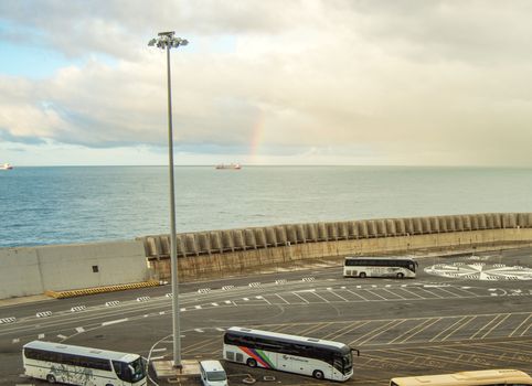 Italy, Civitavecchia, October 07, 2018: View of the pier and Parking of tourist buses, from the deck of the cruise liner MSC Meraviglia