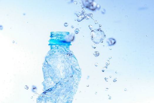 Bottle opening with water splashing isolated on white background